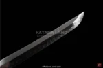 Elegant red katana with intricate Hamon detail