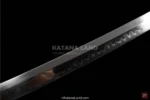 Exquisite red samurai sword featuring Hamon