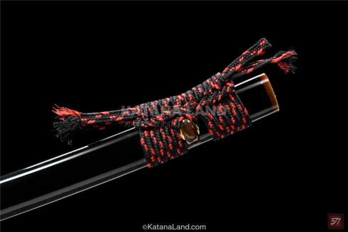Sleek black katana swords with exceptional hamon