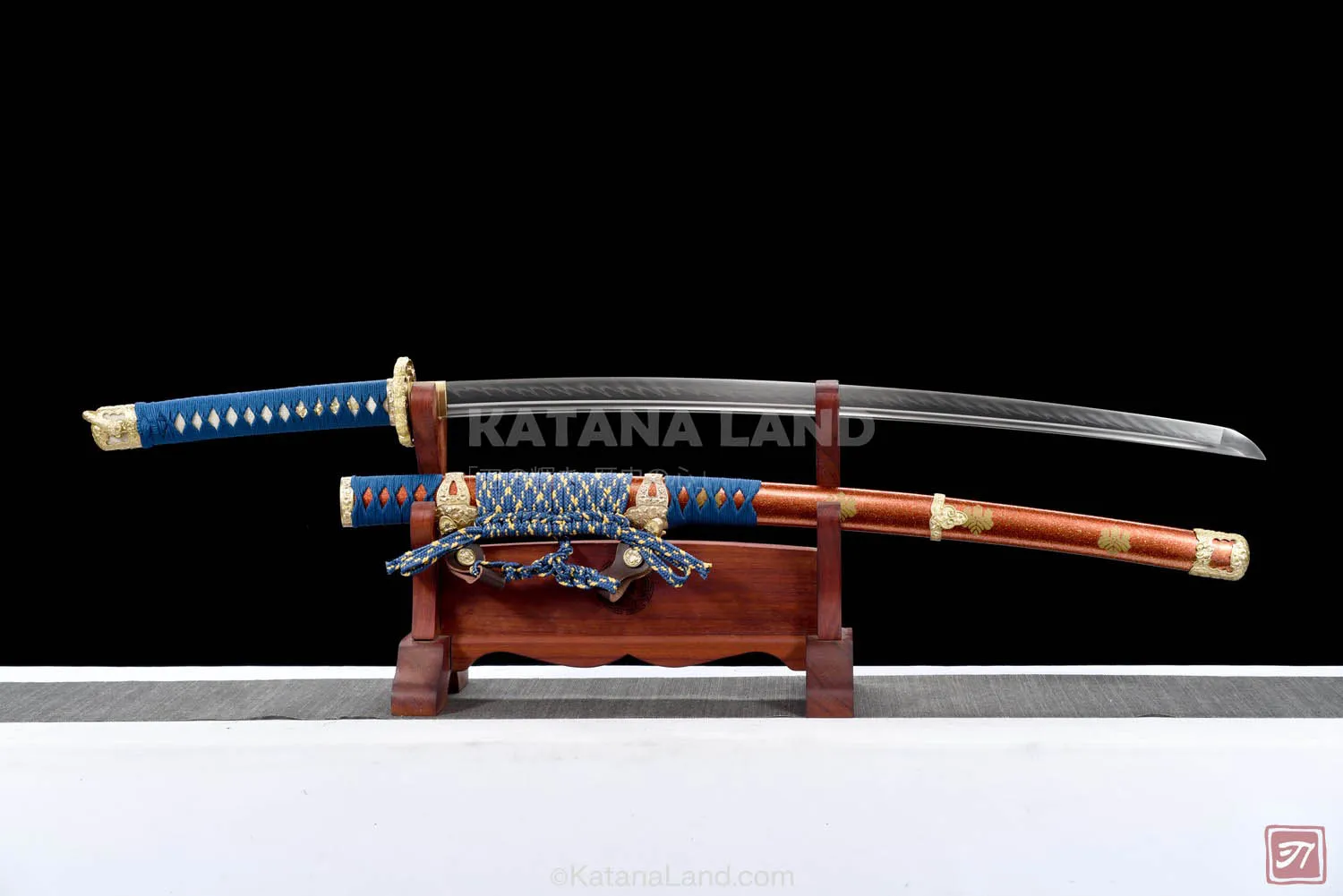 Red katana sword featuring BO-HI and Hamon