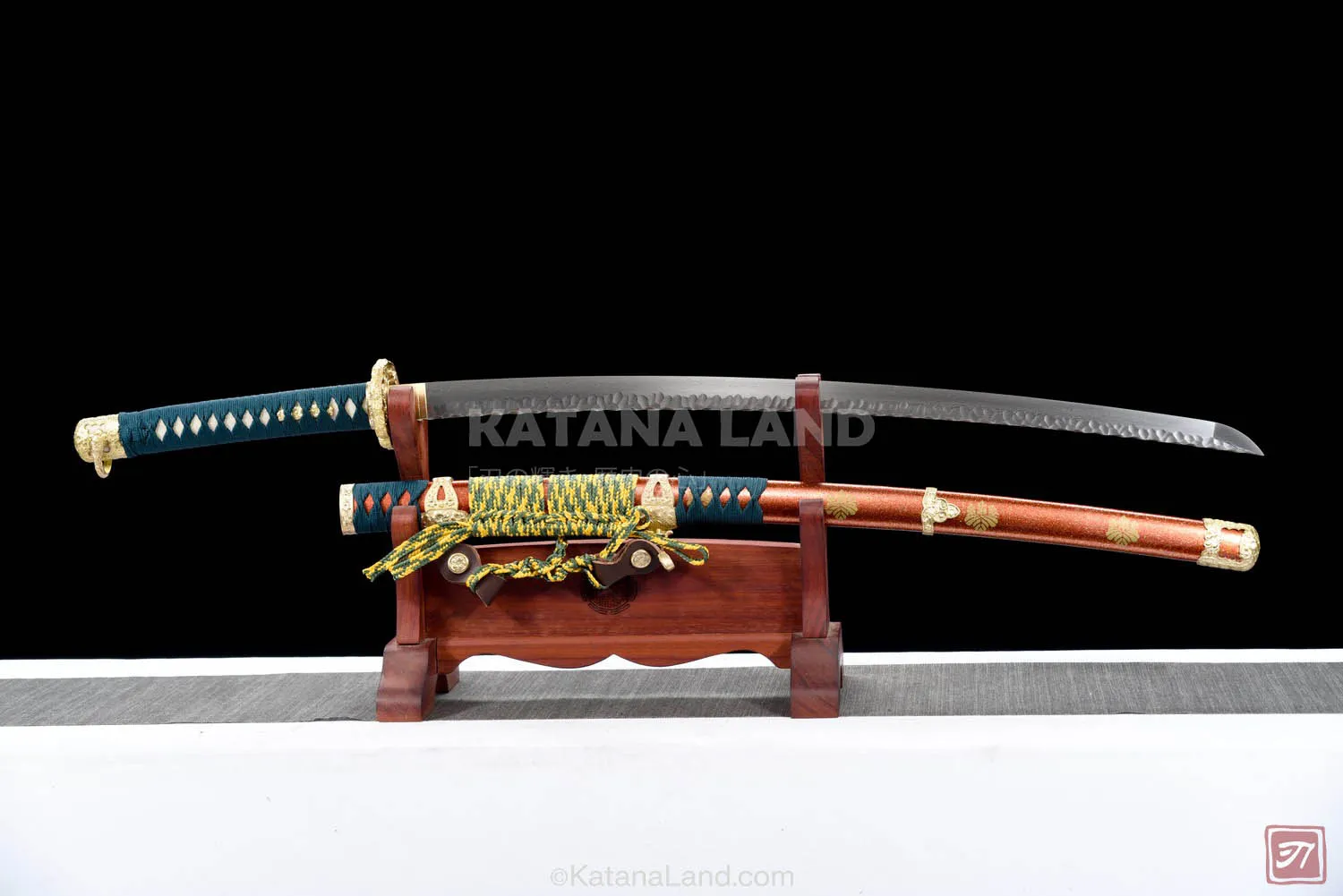 Red katana sword featuring unique Hamon pattern