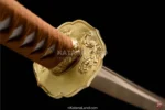 Exquisite bronze samurai katana with distinctive Hamon